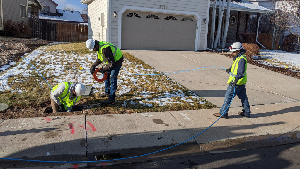 AEG technicians push a big blue flexible plastic rod down a length of conduit to locate the other end of it. They can also use an ordinary fish tape like the orange one here for shorter conduit runs.