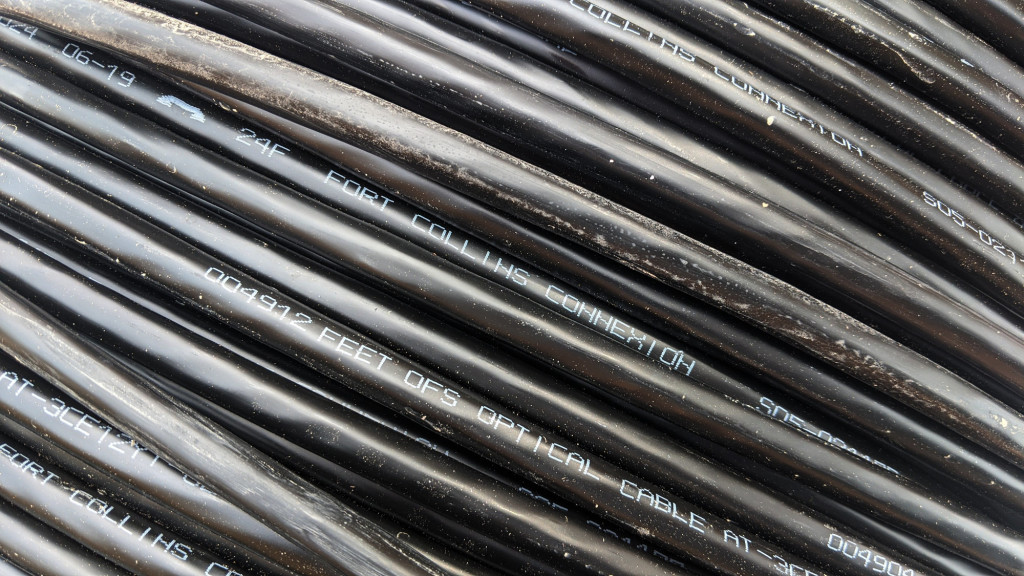 A close up of some Fortex AT-3CE12YT-024 24 fiber cable. All the cables is labeled Fort Collins Connexion.