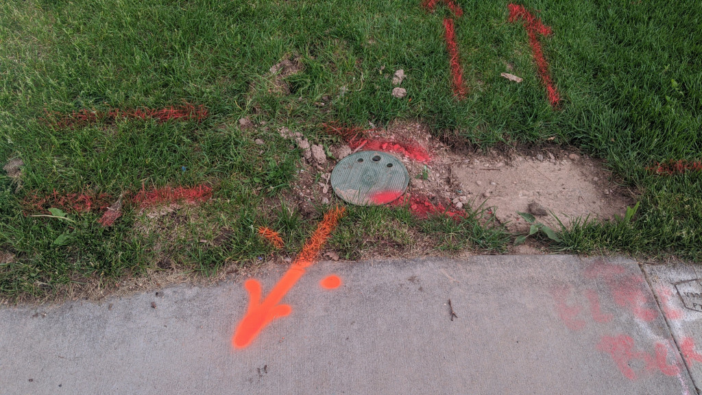Utility locates completed! The orange indicates the location of the existing conduit.