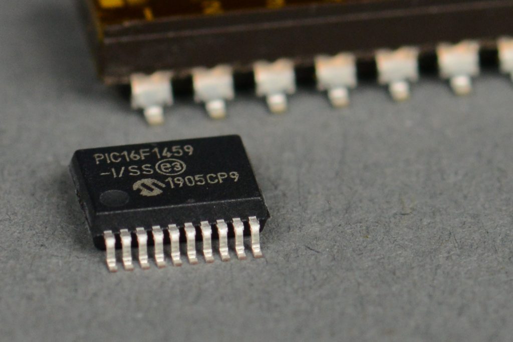 PIC16F1459 in a TSSOP-20 package next to an eight position SMD switch.