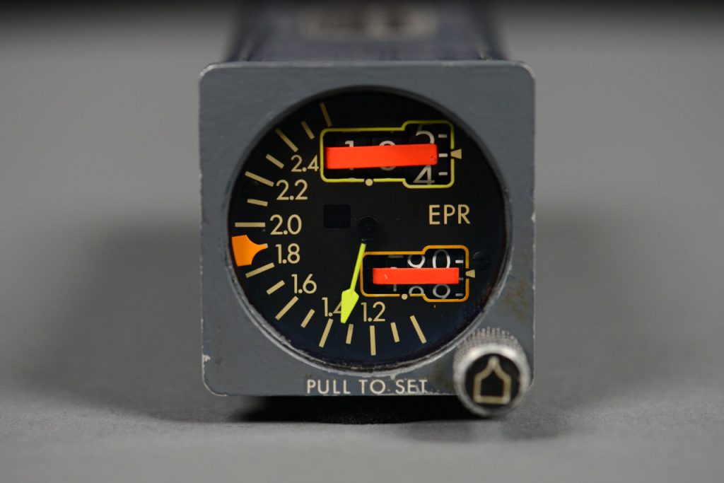 This late 1970's or early 1980's engine pressure ratio indicator has two orange flags to indicate the instrument has lost power or has detected an electrical or mechanical malfunction.