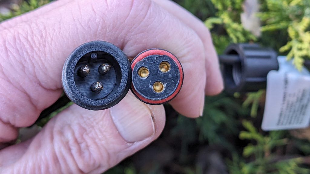 Light string connector on the left, controller connector on the right.