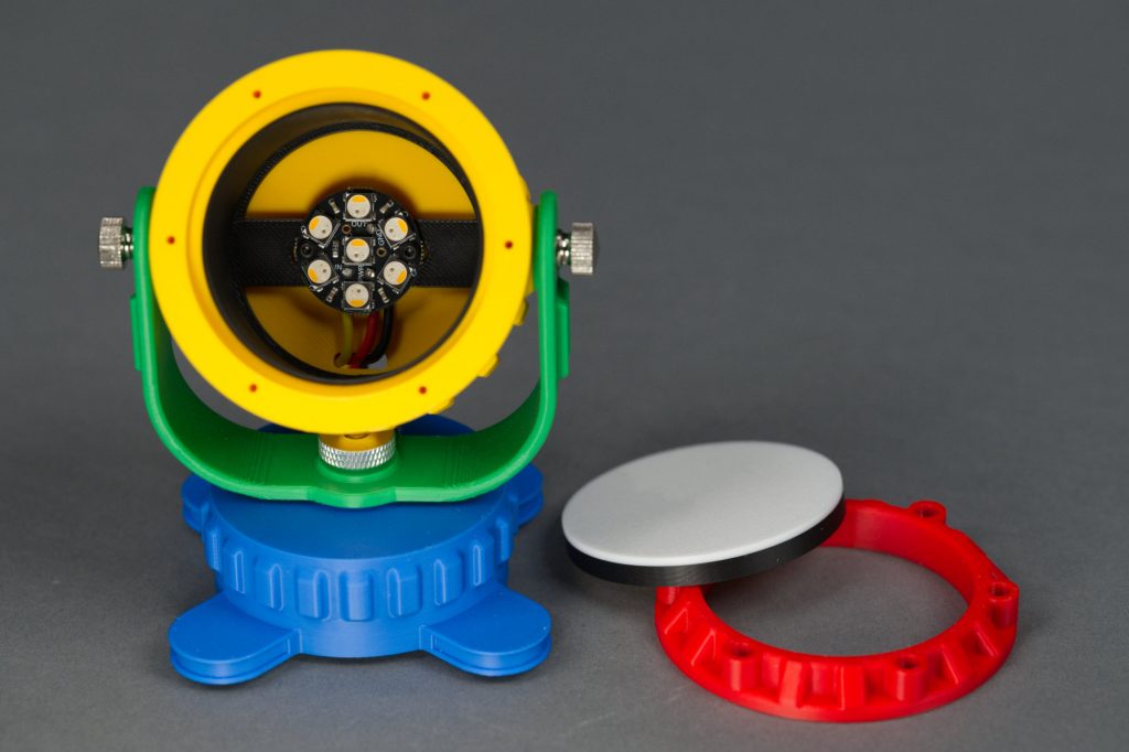     Inside the main body of the fixture is room for an Adafruit Neopixel Jewel 7. There's also a black shield to prevent light from the LEDs spilling through the. yellow plastic of the main body.