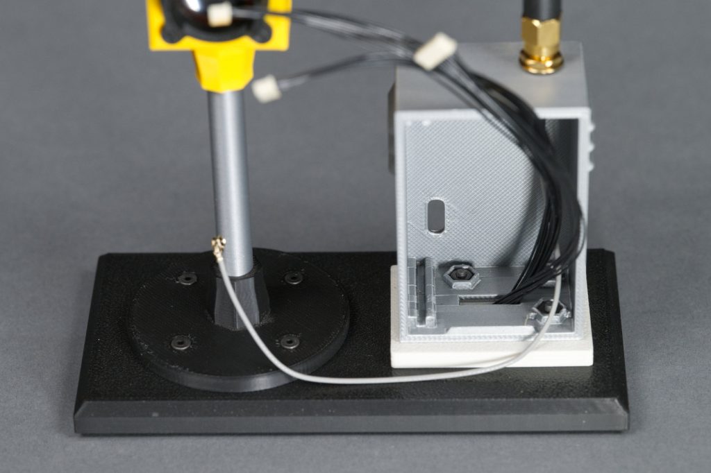 Pull the display cables through the platform and pedestal and into the controller cabinet.