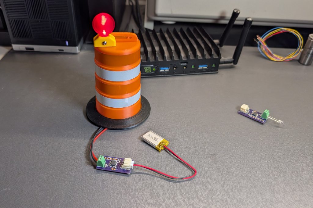 The blinker board connected to the LED on the traffic barrel and the LiPo battery.