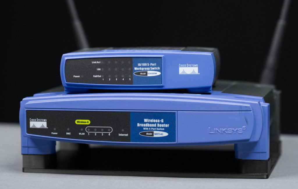 The WRT-54G and a much smaller 5-port Ethernet switch.