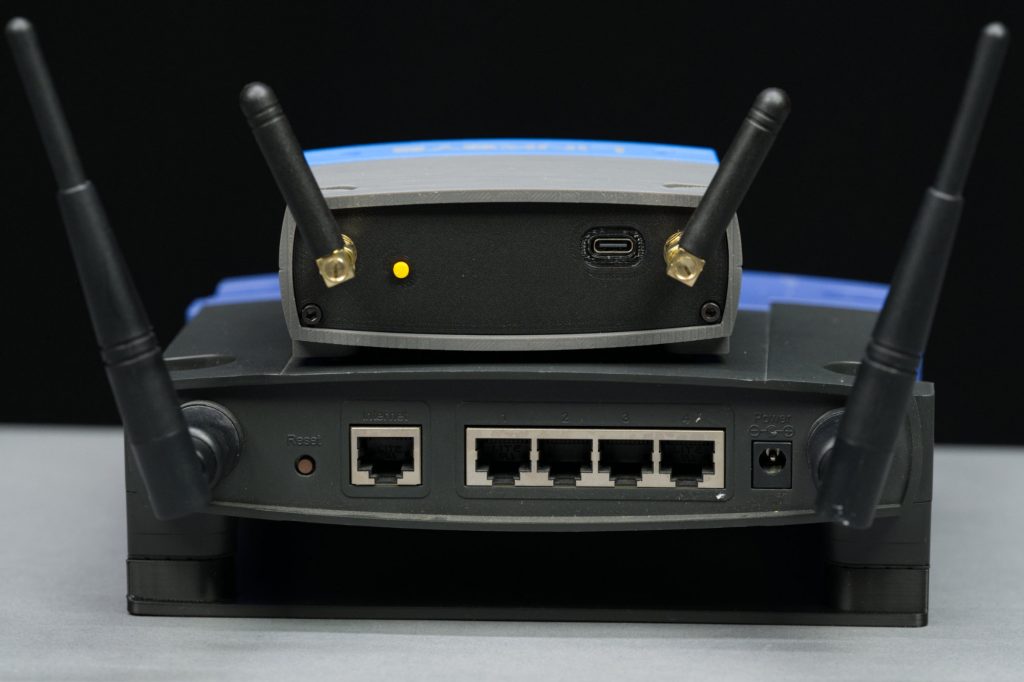 Rear view of the router clock and the WRT-54G wireless router.