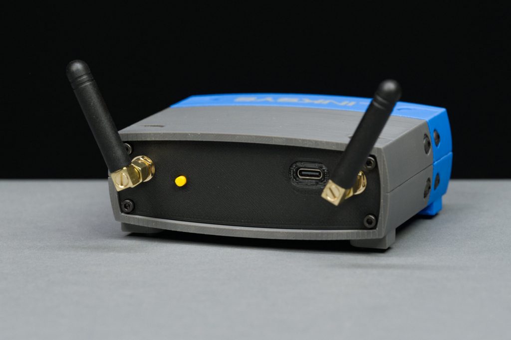 Rear view showing the antenna connectors, AP mode button, and USB type C power / programming connector.